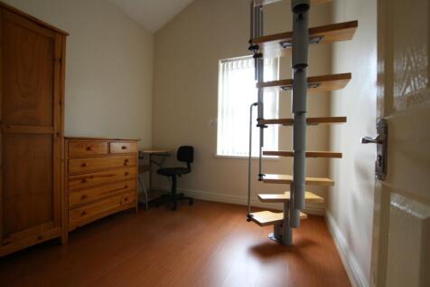A tidy and well-lit hallway featuring modern sp...