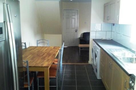 A tidy and functional kitchenette with ample sp...