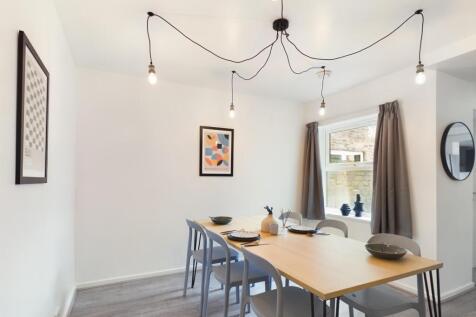 A spacious and stylish modern living room perfe...