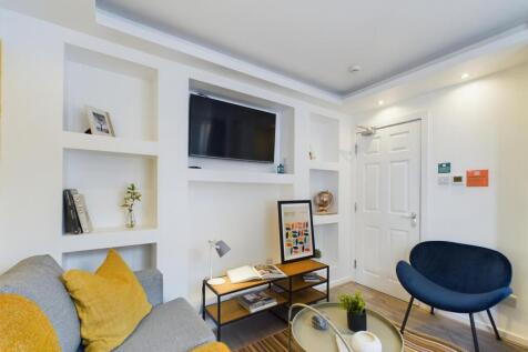 A bright and inviting large modern living room,...