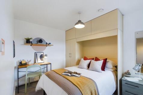 A stylish and inviting double bedroom featuring...