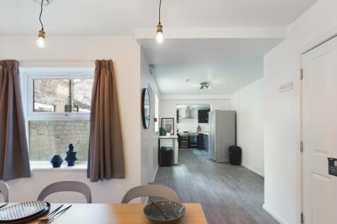 A bright and inviting kitchenette with modern f...