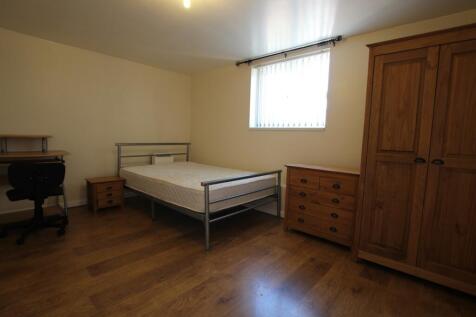A spacious and well-organized double bedroom wi...