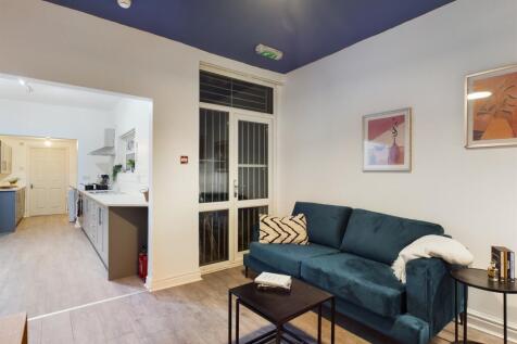 A bright and stylish large modern living room, ...
