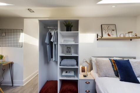 A bright and inviting double bedroom with moder...