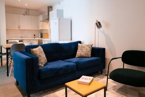 A bright and inviting living room featuring mod...