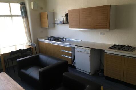 Spacious kitchen featuring ample cabinetry and ...