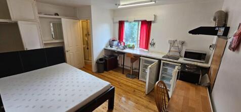 Bright and spacious double bedroom featuring a ...