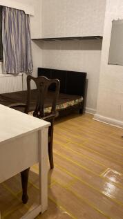 Cozy double bedroom featuring a comfortable bed...