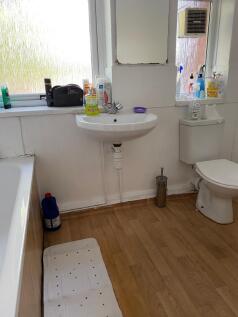 Bright and functional bathroom featuring a spac...