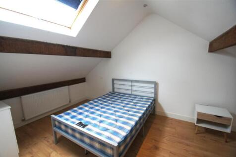 Bright and cozy double bedroom featuring a larg...