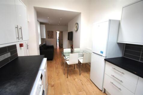 Bright and inviting kitchen area featuring mode...