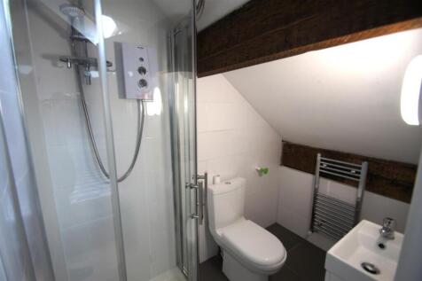 This modern bathroom features a sleek shower wi...