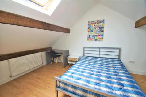 Bright and airy double bedroom featuring a comf...