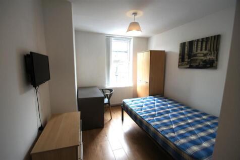 Spacious double bedroom featuring a comfortable...