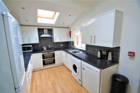 Modern kitchen featuring sleek cabinetry and am...