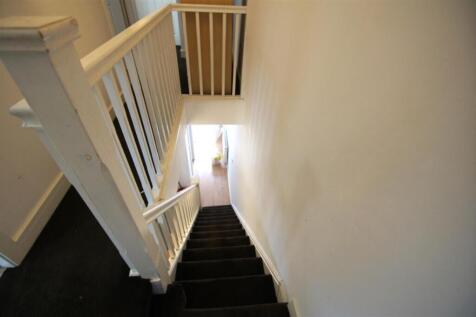 A well-maintained staircase with a clean, invit...