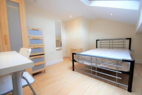Bright and inviting double bedroom featuring sl...