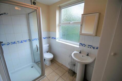 This well-maintained bathroom features a spacio...