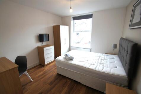Bright and spacious double bedroom featuring a ...