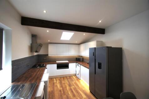 Stylish and modern kitchen featuring sleek cabi...