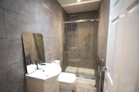 A modern and stylish bathroom featuring elegant...