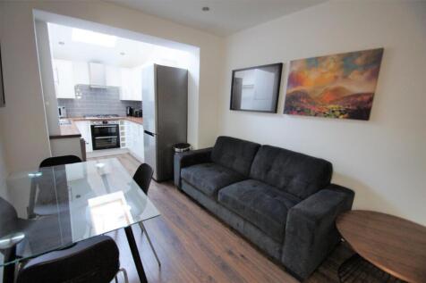 A stylish living room featuring a comfortable s...