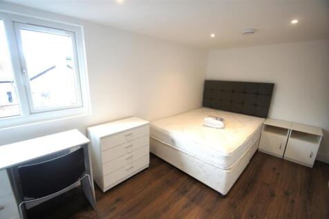A modern double bedroom featuring a comfortable...