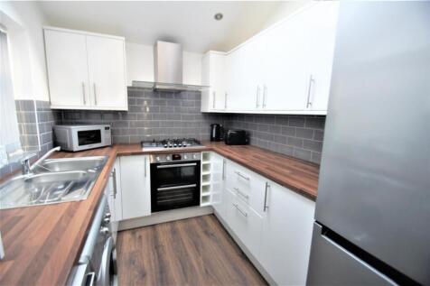 Modern kitchen featuring sleek cabinetry and am...