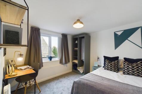 A modern and inviting double bedroom with ample...