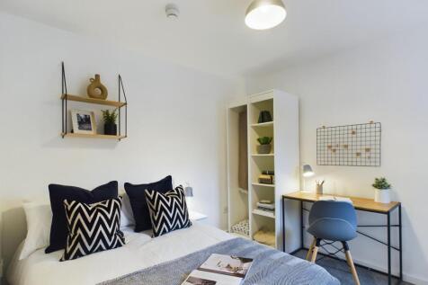 A stylish and inviting double bedroom featuring...