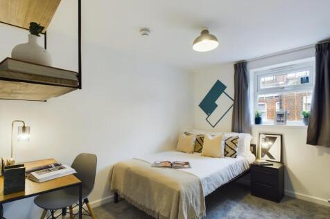 A bright and inviting double bedroom featuring ...