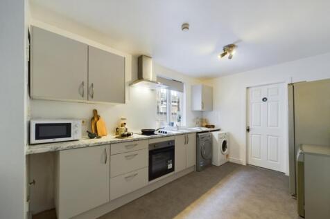A modern and well-equipped kitchenette, perfect...