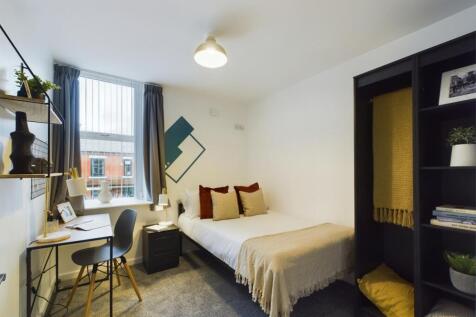A bright and inviting double bedroom featuring ...