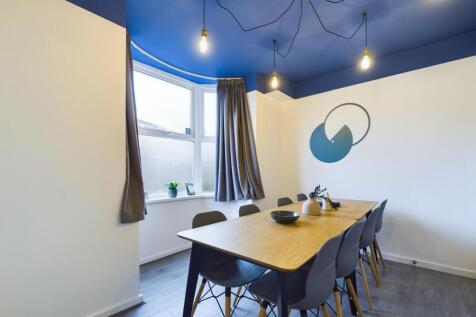 A modern and inviting communal workspace, perfe...