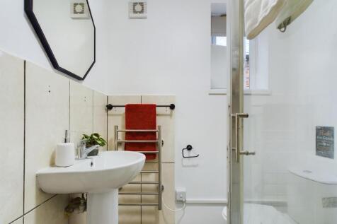 A clean and modern bathroom featuring a stylish...