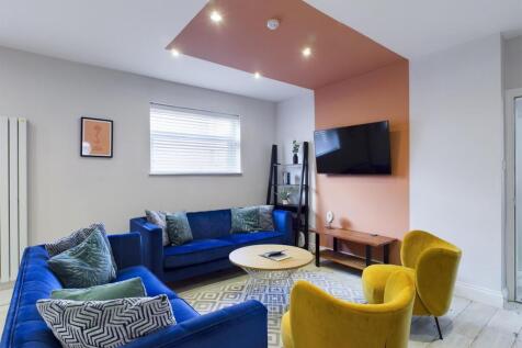 A spacious and inviting modern living room with...