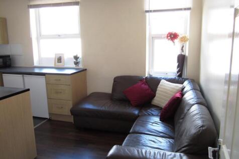 A cozy and inviting living room featuring ample...