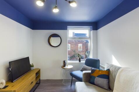 A cozy and modern living room featuring stylish...