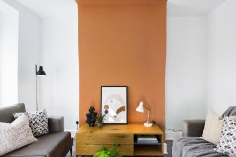 A spacious and stylish modern living room with ...