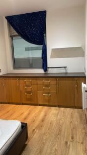 This inviting double bedroom features ample sto...