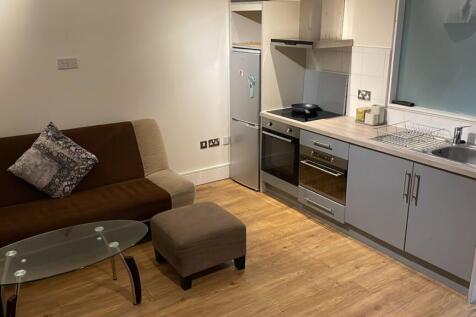 A modern kitchenette featuring sleek appliances...