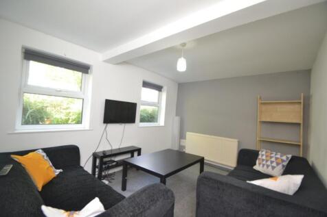 Bright and inviting living room featuring ample...