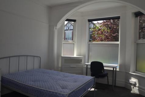 Bright and inviting double bedroom featuring la...