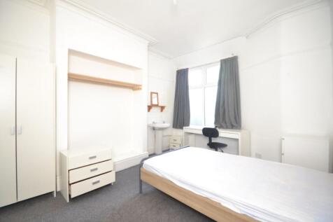 Spacious double bedroom featuring a comfortable...