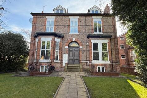 Charming exterior view of a classic brick build...