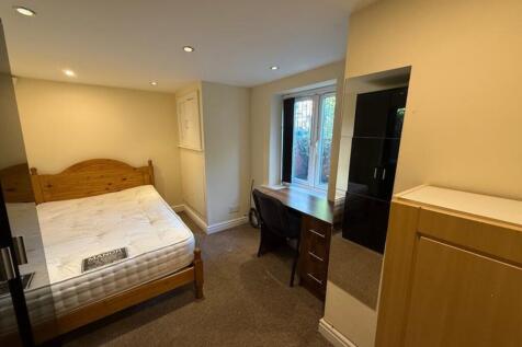 A bright and inviting double bedroom featuring ...