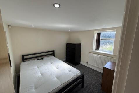 This inviting double bedroom offers a spacious ...
