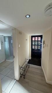 Welcoming hallway featuring modern decor and am...