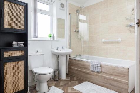This modern bathroom features a clean design wi...